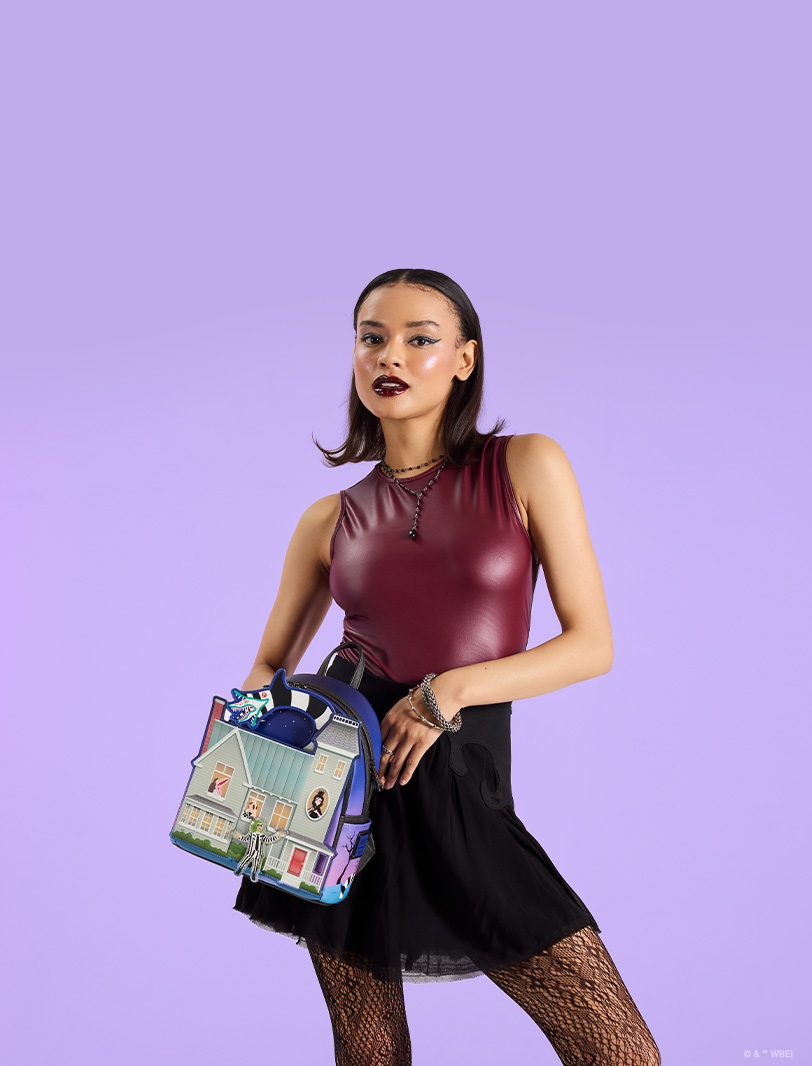 Purple backgroudn with model showcasing Loungefly Beetlejuice collection