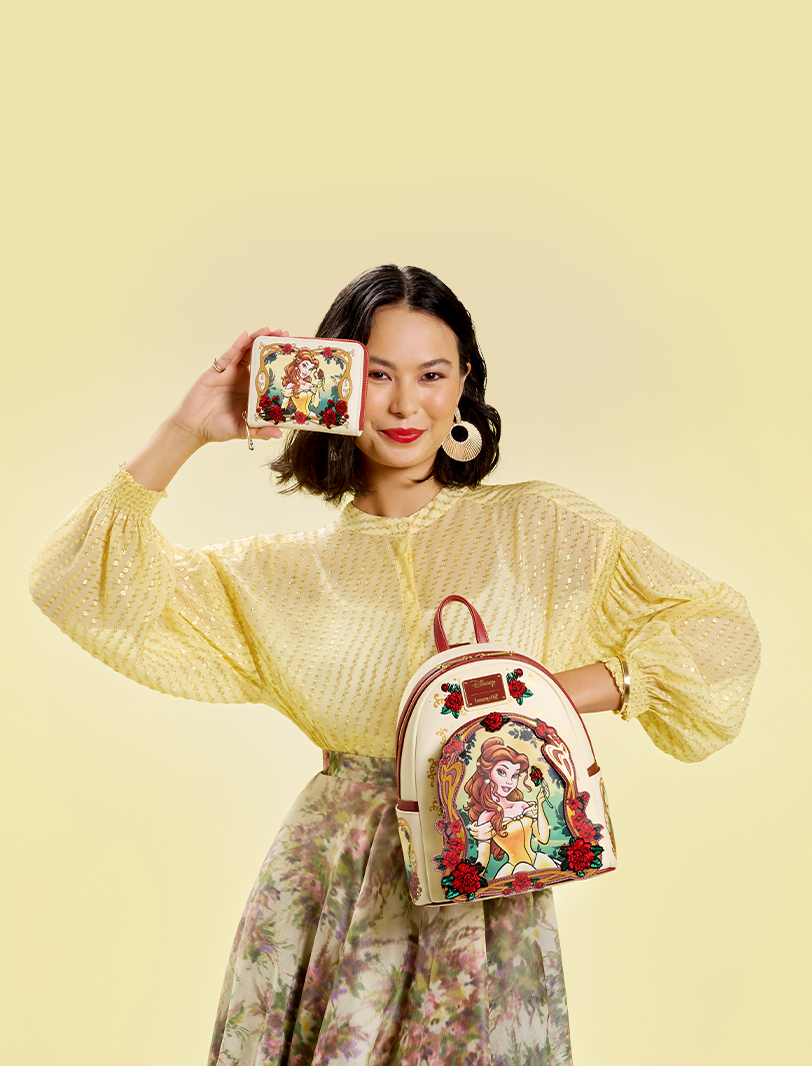 Yellow background with model holding Belle Loungefly backpack and wallet