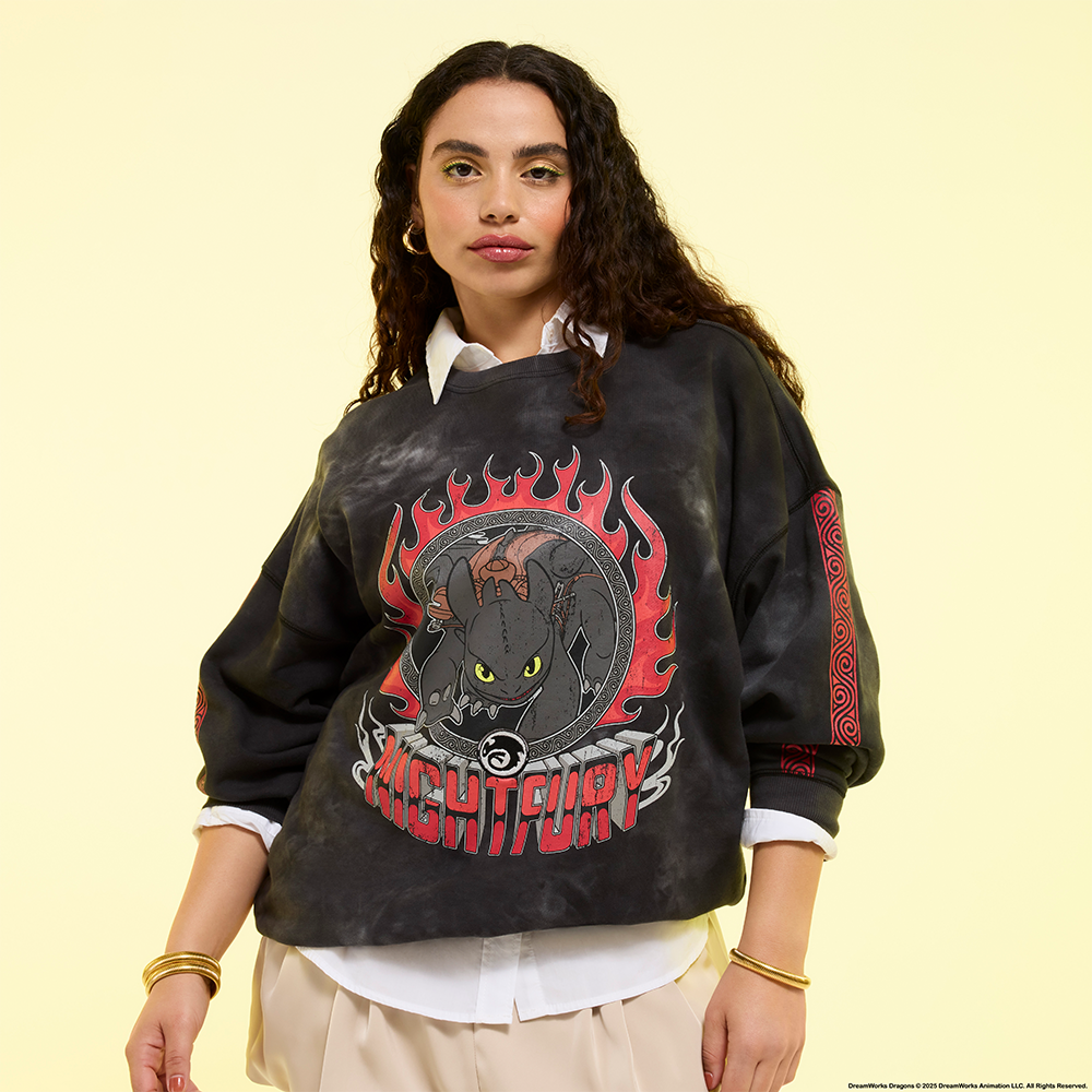 yellow background with model wearing How to train your dragon jumper