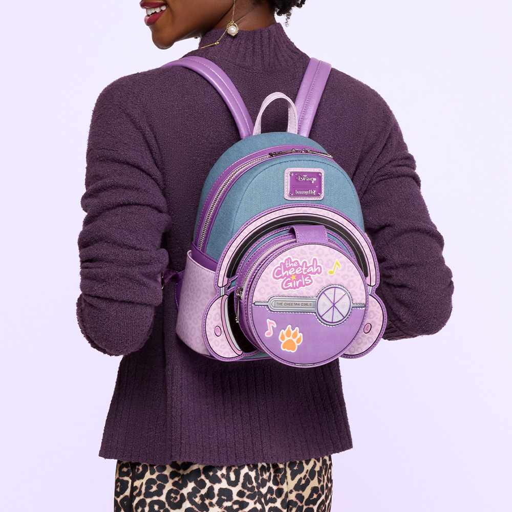 purple background with model wearing Cheetah Girls backpack on her back