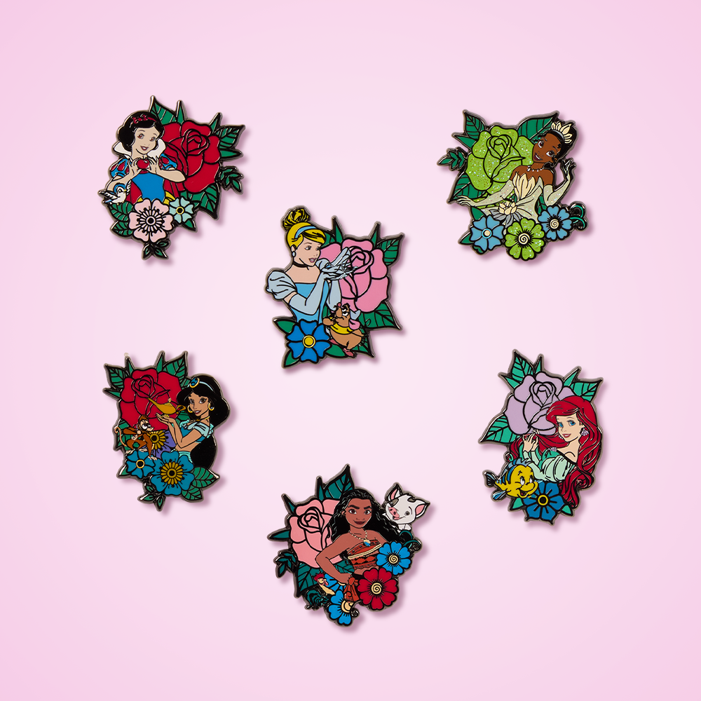 Disney Princess pins against pink background