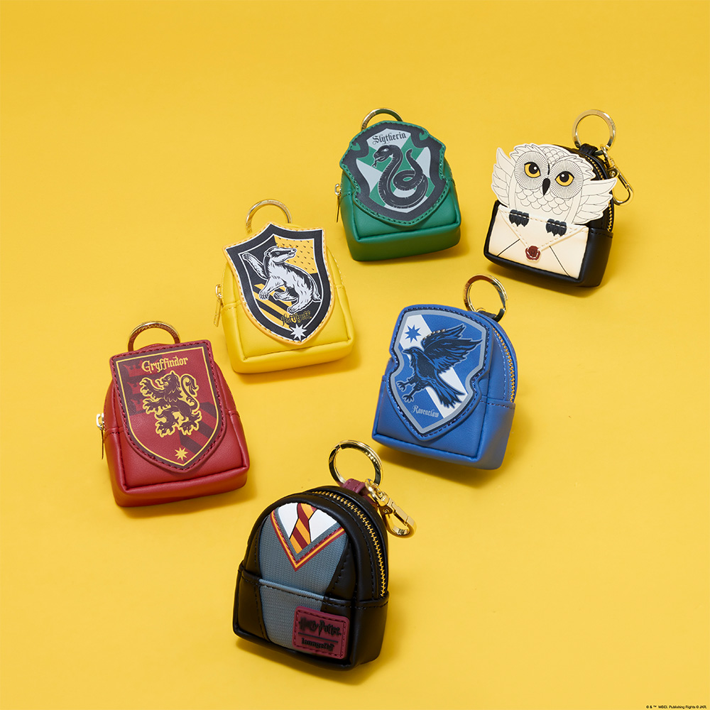Yellow background featuring Loungefly Harry Potter Mystery Mini Backpack keychains