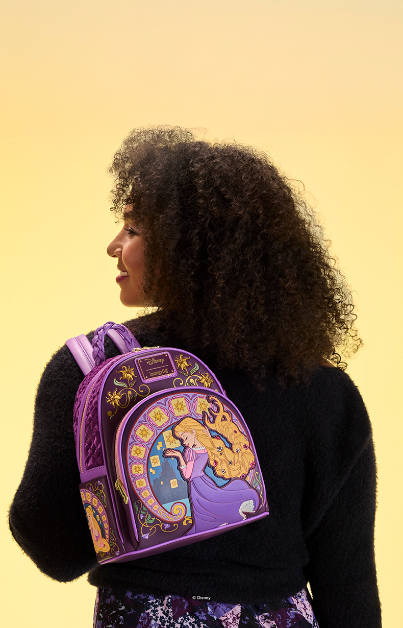 Yellow background with model showcasing Loungefly DIsney Tangled exclusives collection