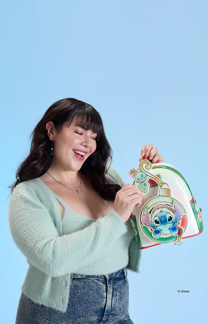 Blue background with model showcasing Loungefly Disney Stitch Holiday collection